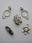 A HM silver charm in the form of a daisy