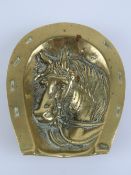 A brass pin tray having hoses head and s