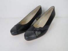 A pair of as new leather shoes.