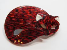 An overlaid plastic brooch in the style of Lea Stein in the form of a sleeping cat, 6cm wide.