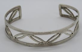 A HM silver bangle having open leaf patt