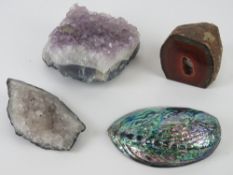 Three geodes together with an abalone sh