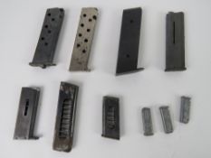 Ten assorted pistol magazines, one marke