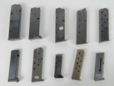 Ten assorted pistol magazines.