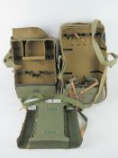 Three military canvas bags with leather