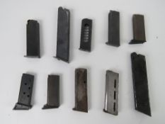 Ten assorted pistol magazines, one marke