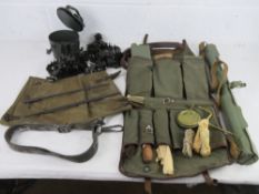 An MG53 accessory kit with breach cover, cleaning rod, five links, spare barrel case, drum magazine,