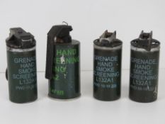 Four inert British military smoke grenades.