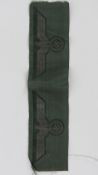 A pair of unused embroidered WWII German uniform patches of swastika and eagle design, 24 x 6cm.
