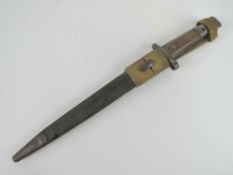 An Enfield Long Lee bayonet with leather scabbard and frog, British marked, serial number 9587.