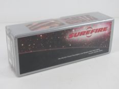 A Surefire Model P114C tactical light, in box with a spare bulb and mount,