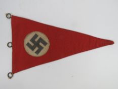 A WWII German car pennant, triangular, in frame.