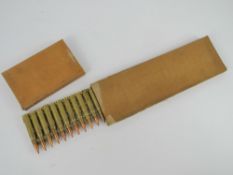 A Japanese 7.7 Woodpecker strip with 30 inert rounds in box.