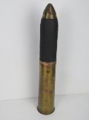 An inert 18lb shell with head and fuse, standing 57cm high.