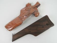A reproduction Mauser C96 'Broom Handle' shoulder stock and holster.