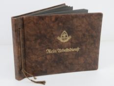 A WWII German photo album containing a quantity of military photos.