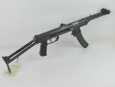 A PPS-43 SMG and accessories set including three magazines, oil bottle, magazine pouch,