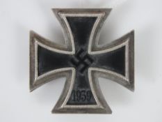 A WWII German Iron Cross badge marked 113 to pin.