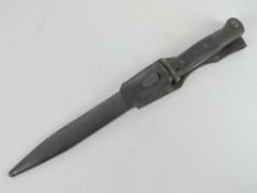 A K98 bayonet with scabbard and leather frog, wooden grips,