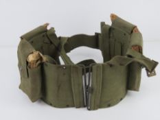 A BAR magazine belt with four unissued BAR magazines.