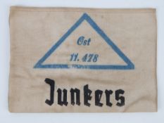 A WWII German Factory Workers arm band, in frame.