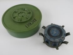 An inert YM-3 mine together with an inert US M131 training mine.