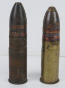 Two 37mm pom pom shells dated 1917 and 1904 respectively, each with double drive bands.