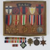 A framed montage of medals including 1939-45 Star, Africa Star, Italy Star, France and Germany Star,