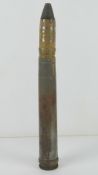 An inert WWII German 3.7cm Flak shell, WWII dated, with original paint on the head.