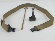 Madsen SMG accessories including magazine loader, sling and cleaning rod.