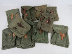 A quantity of AK triple magazine pouches. Ten items.