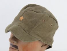 A WWII Japanese last ditch side cap with original leather band.
