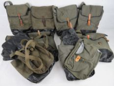Ten AK gas mask bags with AK magazine pouches.