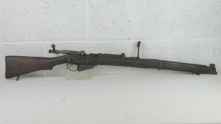 A deactivated British SMLE MKIII with moving trigger, safety, and bolt, but non firing action.