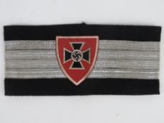 A WWI-WWII German Veterans Officers arm band, in frame.