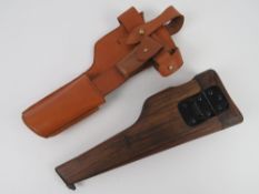 A reproduction Browning High Power shoulder stock and holster.