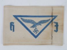 A WWII German Hitler Youth Airforce arm band, in frame.