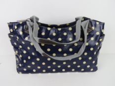 A blue polka dot pattern handbag 'as new', approx 39 x 26cm.