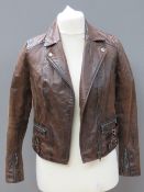 A brown leather biker style jacket by New Look size 10.