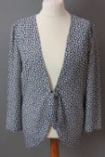 Frank Usher; a light floral jacket having tie waist in navy and white, UK size 12.
