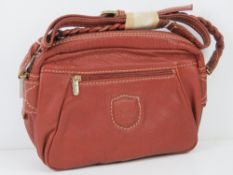 A vintage Italian made handbag in red, made by Gemel and measuring 29 x 20cm.