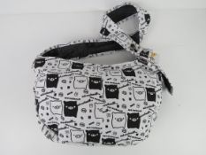 A cross body fabric bag having pig themed pattern 'as new', approx 40 x 24cm.