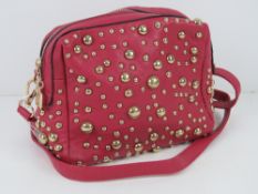An 'as new' pink studded handbag handbag 19 x 17cm.
