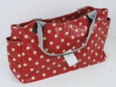 An 'as new' red polka dot handbag 49 x 23cm.