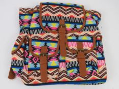 An Aztec pattern multi coloured ruck sack 'as new' 35 x 35cm.