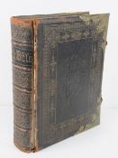 A leather bound illustrated family bible published by John McGready Glasgow,