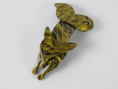 An overlaid plastic brooch in the style of Lea Stein in the form of a fox, 7cm in length.