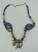 A Native American style handmade necklace having lapis lazuli, coral and turquoise beading,