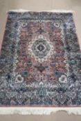 A silk pink and blue ground rug having geometric design, 180 x 126cm.
