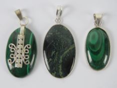 Two malachite pendants each with white metal setting stamped 925,